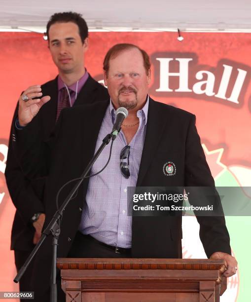 Manager of the senior Canadian Menâs baseball team Ernie Whitt speaks with former pitcher Jeff Francis looking on behind him during the induction...