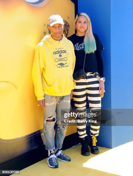 Recording artist Pharrell Williams and wife Helen Lasichanh attend the premiere of Universal Pictures And Illumination Entertainment's 'Despicable Me...