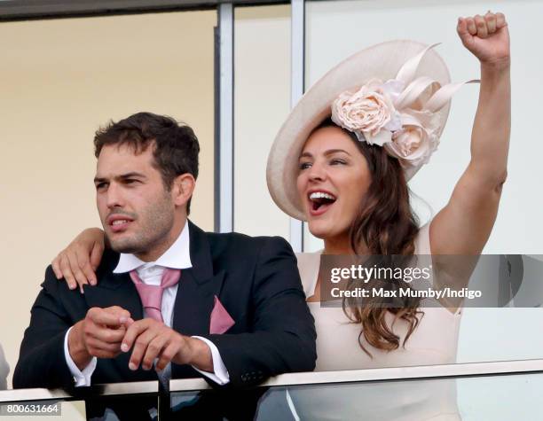 Jeremy Parisi and Kelly Brook watch the racing as they attend day 5 of Royal Ascot at Ascot Racecourse on June 24, 2017 in Ascot, England.