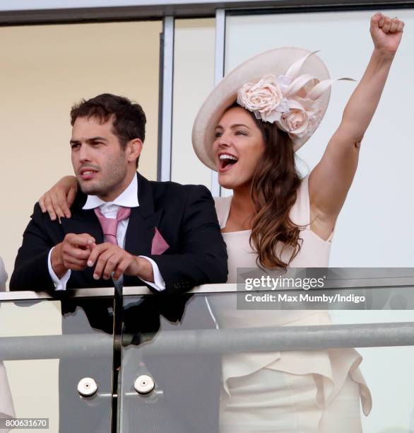 Jeremy Parisi and Kelly Brook watch the racing as they attend day 5 of Royal Ascot at Ascot Racecourse on June 24, 2017 in Ascot, England.