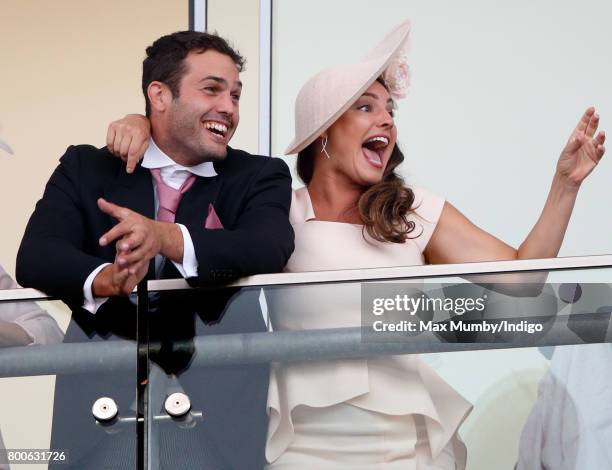 Jeremy Parisi and Kelly Brook watch the racing as they attend day 5 of Royal Ascot at Ascot Racecourse on June 24, 2017 in Ascot, England.