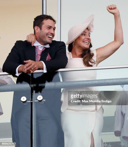 Jeremy Parisi and Kelly Brook watch the racing as they attend day 5 of Royal Ascot at Ascot Racecourse on June 24, 2017 in Ascot, England.