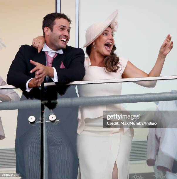 Jeremy Parisi and Kelly Brook watch the racing as they attend day 5 of Royal Ascot at Ascot Racecourse on June 24, 2017 in Ascot, England.