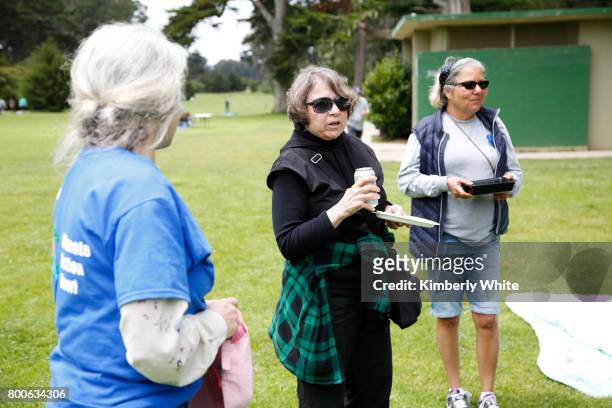 People attend the Resistance Summer Community Potluck in Golden Gate Park on June 24, 2017 in San Francisco, California.