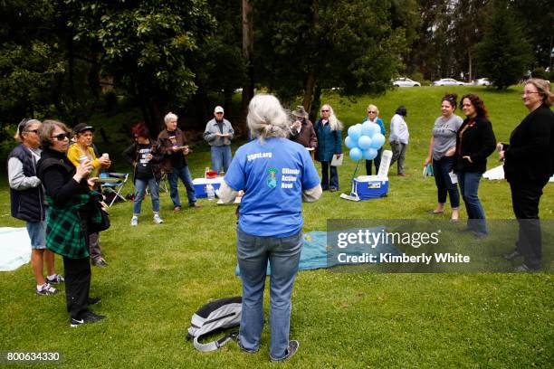 People attend the Resistance Summer Community Potluck in Golden Gate Park on June 24, 2017 in San Francisco, California.