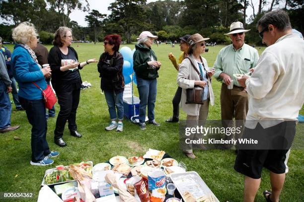 People attend the Resistance Summer Community Potluck in Golden Gate Park on June 24, 2017 in San Francisco, California.