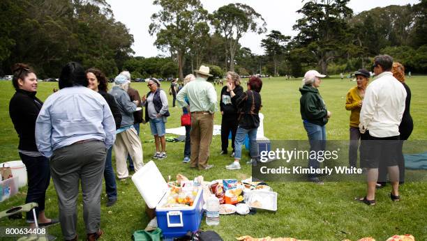 People attend the Resistance Summer Community Potluck in Golden Gate Park on June 24, 2017 in San Francisco, California.