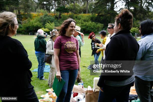 People attend the Resistance Summer Community Potluck in Golden Gate Park on June 24, 2017 in San Francisco, California.