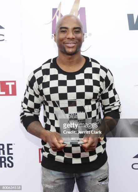 Charlamagne tha God poses with his award at Culture Creators 2nd Annual Awards Brunch Presented By Motions Hair And Ciroc at Mr. C Beverly Hills on...