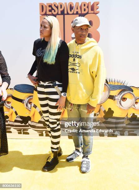 Singer Pharrell Williams and Helen Lasichanh arrive at the premiere of Universal Pictures and Illumination Entertainment's "Despicable Me 3" at The...