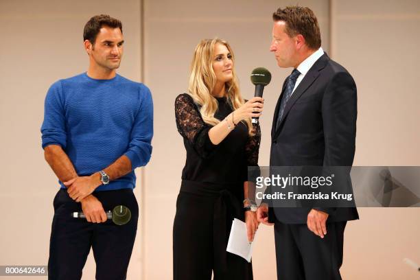 Tennis player Roger Federer, presenter Anna Kraft and CEO Ralf Weber attend the Gerry Weber Open Fashion Night 2017 during the Gerry Weber Open 2017...