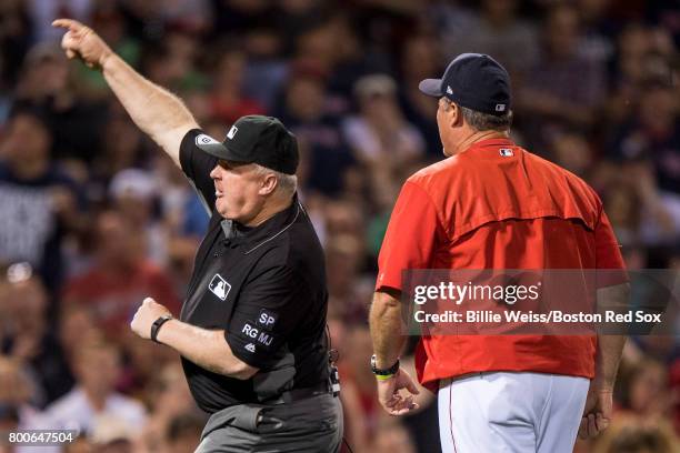 Manager John Farrell of the Boston Red Sox is ejected from the game by umpire Bill Miller after arguing a balk call during the seventh inning of a...