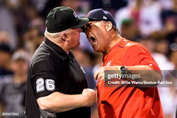 Manager John Farrell of the Boston Red Sox argues a balk call with the umpire Bill Miller during the seventh inning of a game against the Los Angeles...