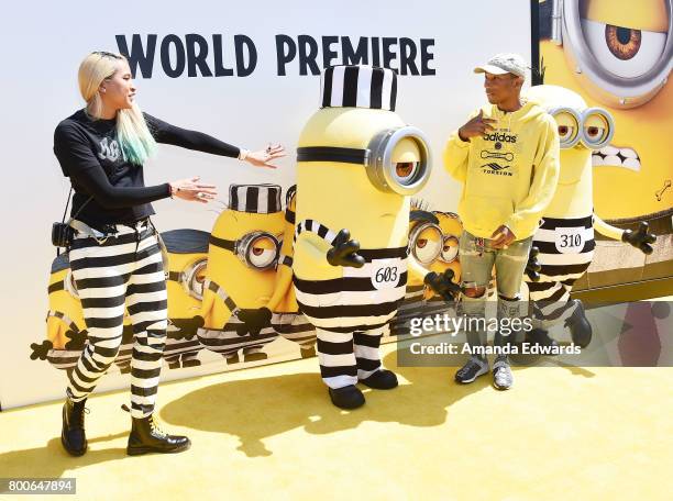 Singer Pharrell Williams and Helen Lasichanh arrive at the premiere of Universal Pictures and Illumination Entertainment's "Despicable Me 3" at The...