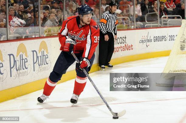 David Steckel of the Washington Capitals handles the puck against the Minnesota Wild at the Verizon Center on February 26, 2008 in Washington, DC.