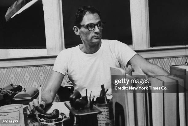 American playwright Arthur Miller at his desk, circa 1955.