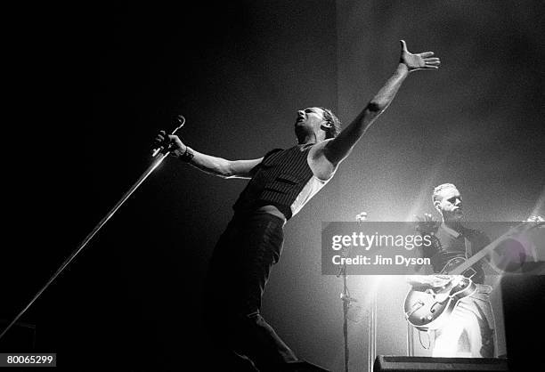 Dave Gahan and Martin Gore of Depeche Mode perform at Wembley Arena on October 18, 2001 in London, England.