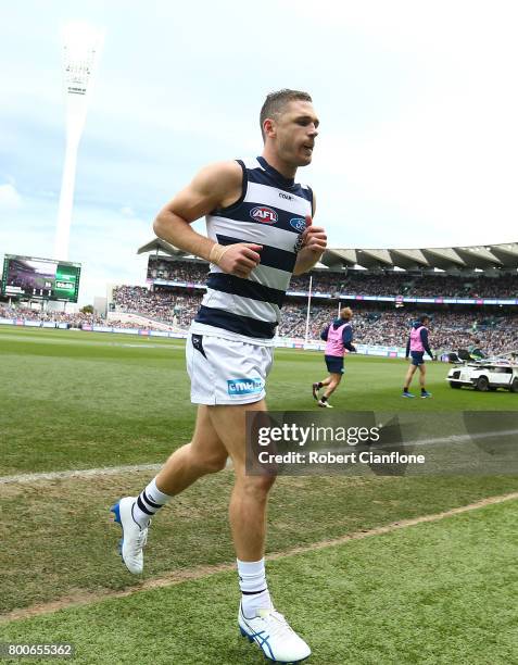 Joel Selwood of the Cats comes off the ground after he was knocked out during the round 14 AFL match between the Geelong Cats and the Fremantle...