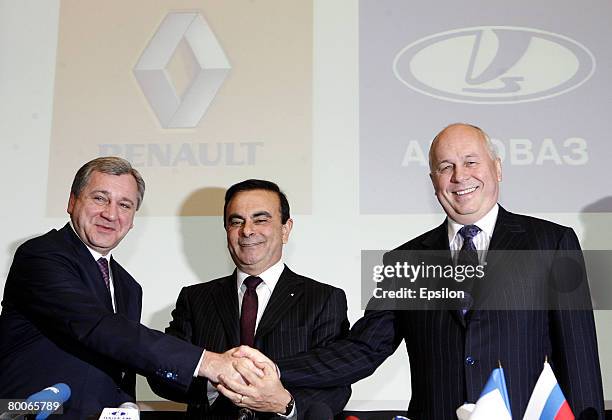 President of Avtovaz Boris Aleshin , Renault CEO Carlos Ghosn and Sergei Chemezov head of Russia's state-owned Rostekhnologi corporation shake hands...