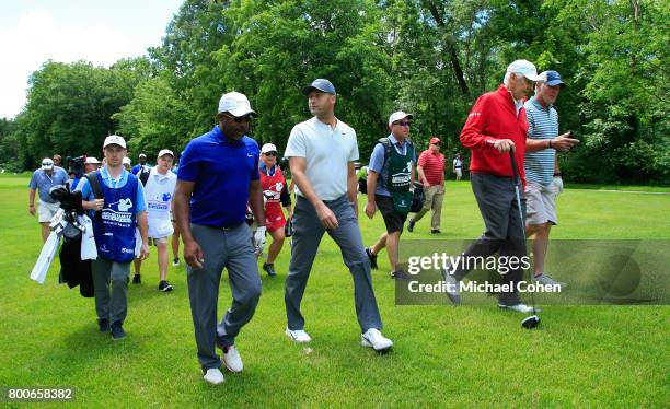Darius Rucker, Derek Jeter, Andy North and Bret Favre walk the fairway during the Celebrity Foursome to benefit the American Family Children's...