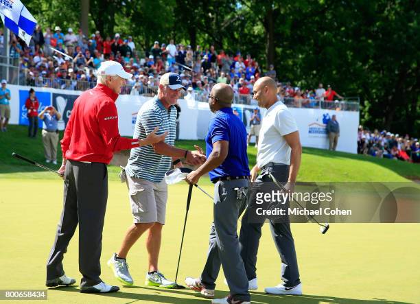 Andy North,Bret Favre,Darius Rucker and Derek Jeter shake hands at the conclusion of the Celebrity Foursome to benefit the American Family Children's...