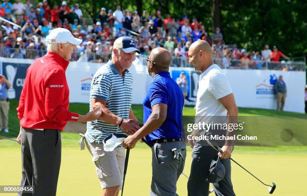 Andy North,Bret Favre,Darius Rucker and Derek Jeter shake hands at the conclusion of the Celebrity Foursome to benefit the American Family Children's...