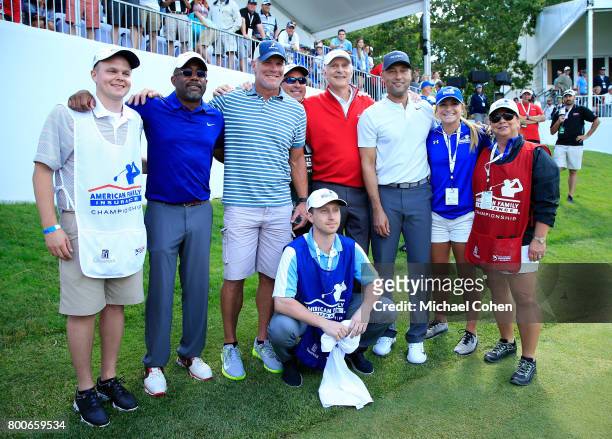 Darius Rucker,Bret Favre,Andy North and Derek Jeter and their caddies pose for a photo after playing in the Celebrity Challenge benefiting the...