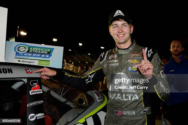 William Byron, driver of the AXALTA/WINDSORWindow&Door Chevrolet, poses with the winners decal after winning the NASCAR XFINITY Series American...