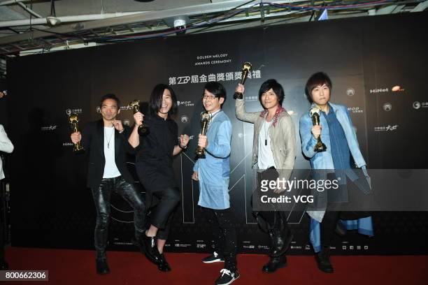 Group Mayday celebrate at the backstage after winning the Best Album Mandarin award of the 28th Golden Melody Awards on June 24, 2017 in Taipei,...