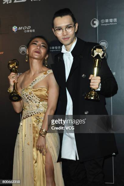 The Best Female Vocalist Mandarin award winner Eve Ai and the Best Male Vocalist Mandarin award winner Khalil Fong celebrate at the backstage of the...