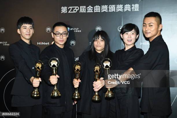 Group No Party for Cao Dong celebrate at the backstage after winning the Best New Artist award, the Best Musical Group award and the Song of the Year...