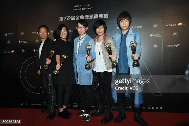 Group Mayday celebrate at the backstage after winning the Best Album Mandarin award of the 28th Golden Melody Awards on June 24, 2017 in Taipei,...