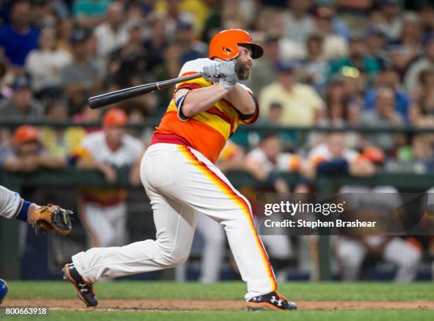 Brian McCann of the Houston Astros hits a three-run double off of relief pitcher Steve Cishek of the Seattle Mariners that scored Carlos Correa, of...