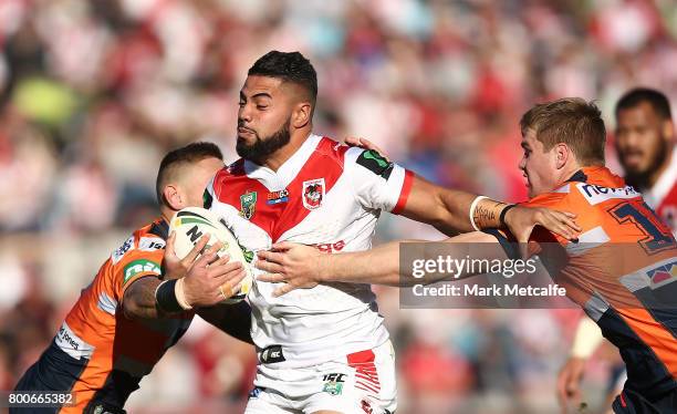 Hame Sele of the Dragons is tackled during the round 16 NRL match between the St George Illawarra Dragons and the Newcastle Knights at UOW Jubilee...