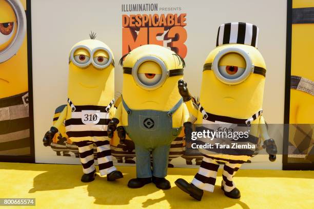 Minions pose for a photo on the yellow carpet at the Premiere Of Universal Pictures And Illumination Entertainment's 'Despicable Me 3' at The Shrine...