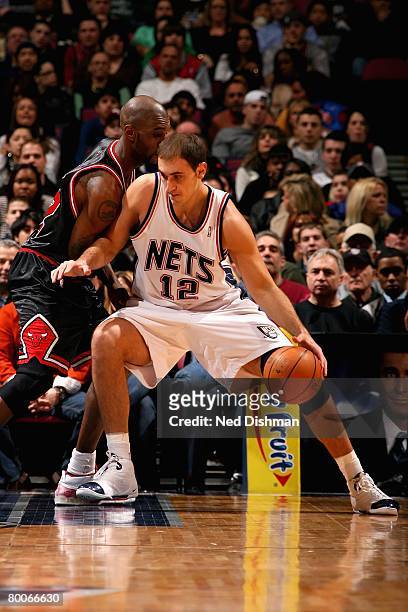 Nenad Krstic of the New Jersey Nets goes up against Joe Smith of the Chicago Bulls during the game on February 20, 2008 at the Izod Center in East...