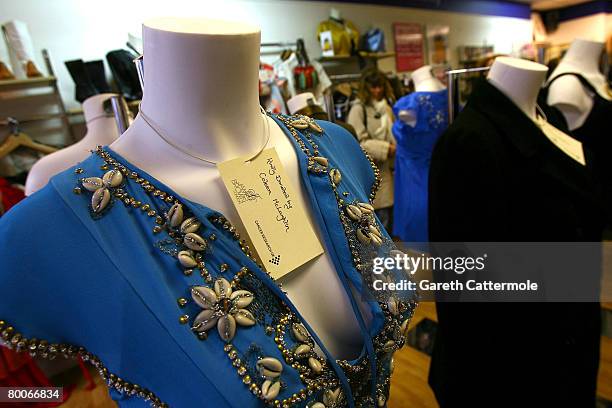 Dress donated by Colleen McLoughlin stands on display inside the Cancer Research UK shop on Marylebone High Street during the Make Today Count...