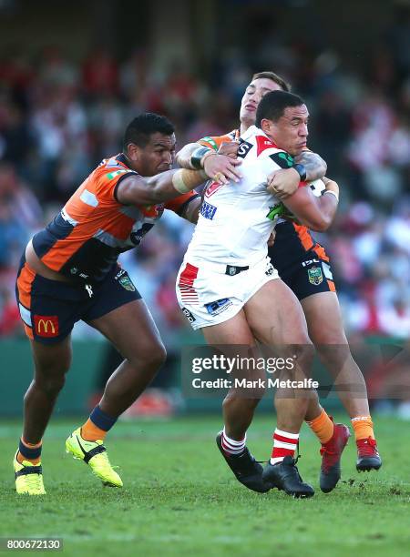 Tyson Frizell of the Dragons is tackled during the round 16 NRL match between the St George Illawarra Dragons and the Newcastle Knights at UOW...