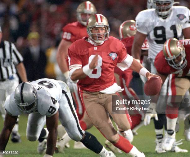San Francisco 49ers quarterback Steve Young scrambles during 44-14 victory over the Los Angeles Raiders in Monday Night Football game at Candlestick...