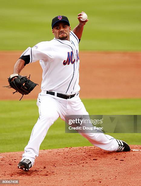 Starting pitcher Johan Santana of the New York Mets pitches against the St. Louis Cardinals in a Spring Training game at Tradition Field on February...