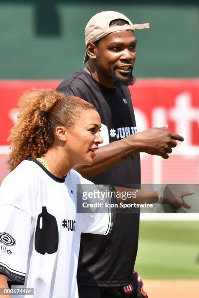 Golden State Warriors Kevin Durant and Ros Gold Onwude talk trash to each other during JaVale McGees JUGLIFE charity softball game on June 24 at...