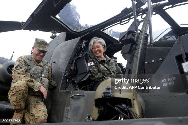 South Korea's Foreign Minister Kang Kyung-Wha sits in a AH-64D Apache longbow helicopter as she visits the headquarters of the South Korea-US...