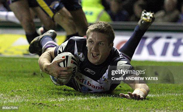 Melbourne Storm's Ryan Hoffman scores the first try during the Rugby League world club challenge against Leeds Rhinos at Elland Road, Leeds, England,...