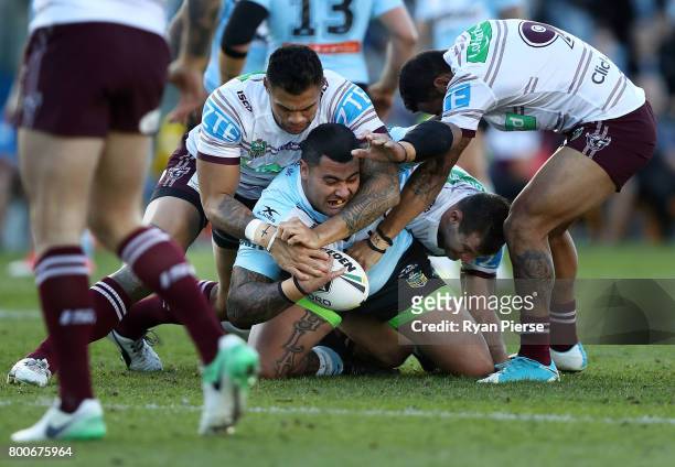 Andrew Fifita of the Sharks is tackled during the round 16 NRL match between the Cronulla Sharks and the Manly Sea Eagles at Southern Cross Group...