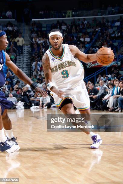 Morris Peterson of the New Orleans Hornets drives to the basket past Josh Howard of the Dallas Mavericks during the game on February 20, 2008 at the...