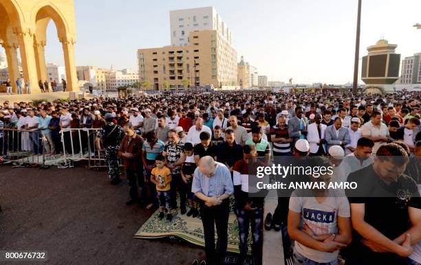 Muslim Sunni worshippers pray outside the Mohammad al-Amin mosque in downtown Beirut to mark Eid al-Fitr, the end of the Muslim holy month of...