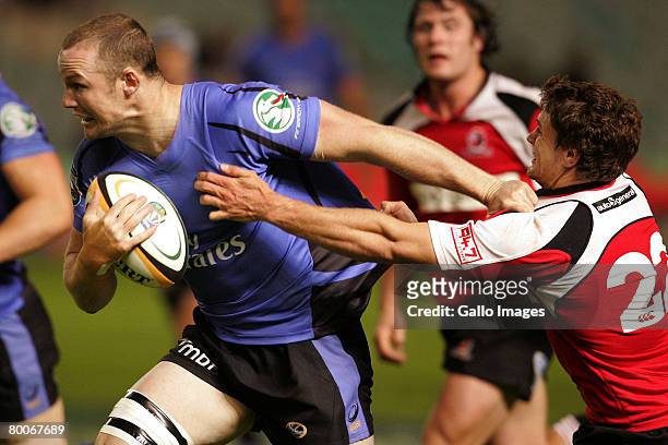 Jannie Boshoff tackles Richard Brown during the Super 14 Round 3 match between Lions and Western Force held at Ellis Park Stadium on February 29,...