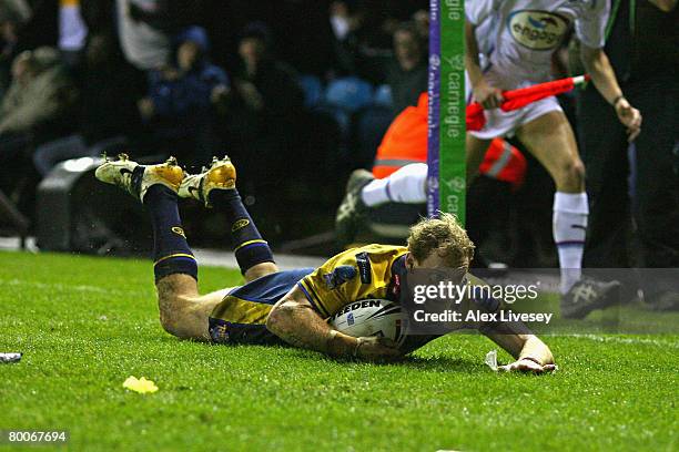 Scott Donald of Leeds Rhinos scores his team's first try during the Carnegie World Club Challenge match between Leeds Rhinos and Melbourne Storm at...