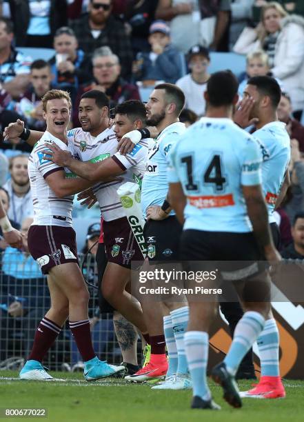 Matthew Wright and Dale Cherry-Evans of the Sea Eagles celebrates after Wright scored a try during the round 16 NRL match between the Cronulla Sharks...