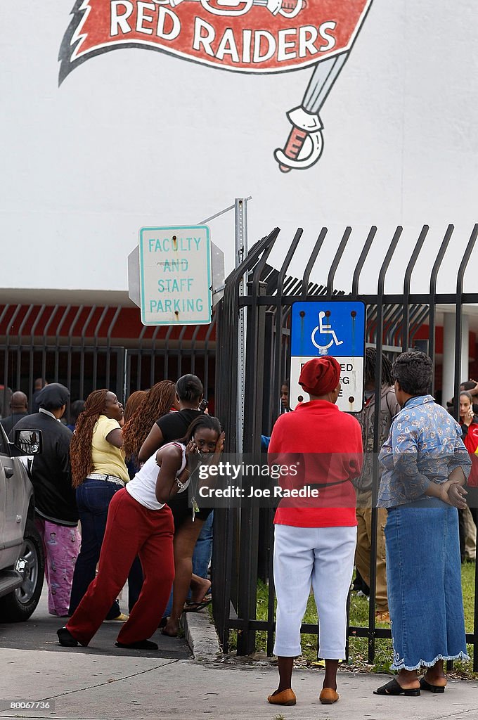 Miami Edison Riot Parents wait near the front gate to Miami Edison Senior High School ...
